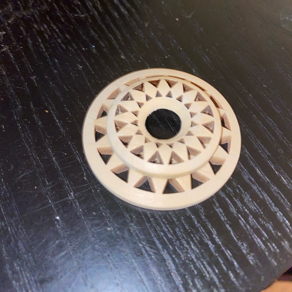 Wood cutout sphere stand